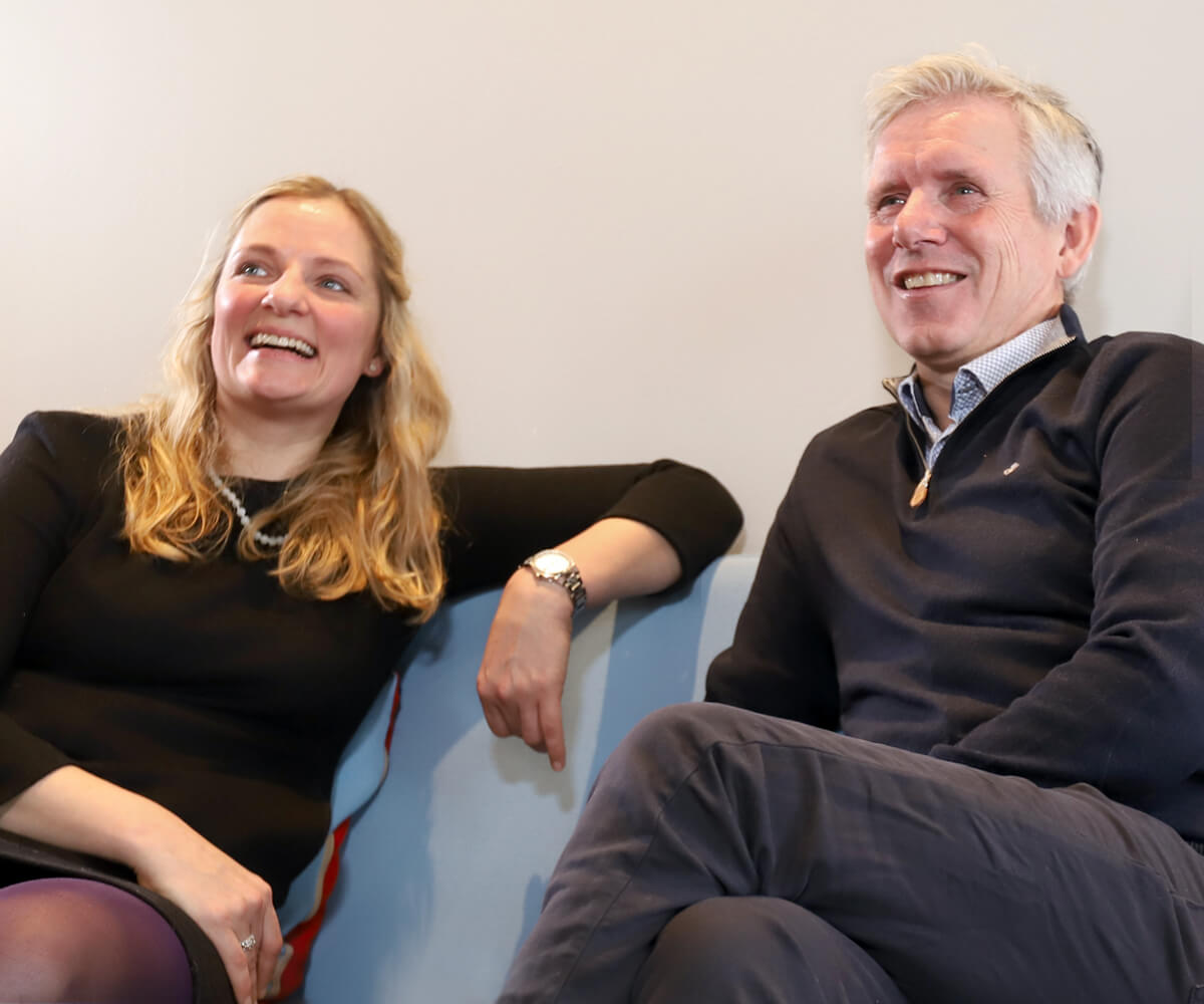 Man and woman sitting in a sofa